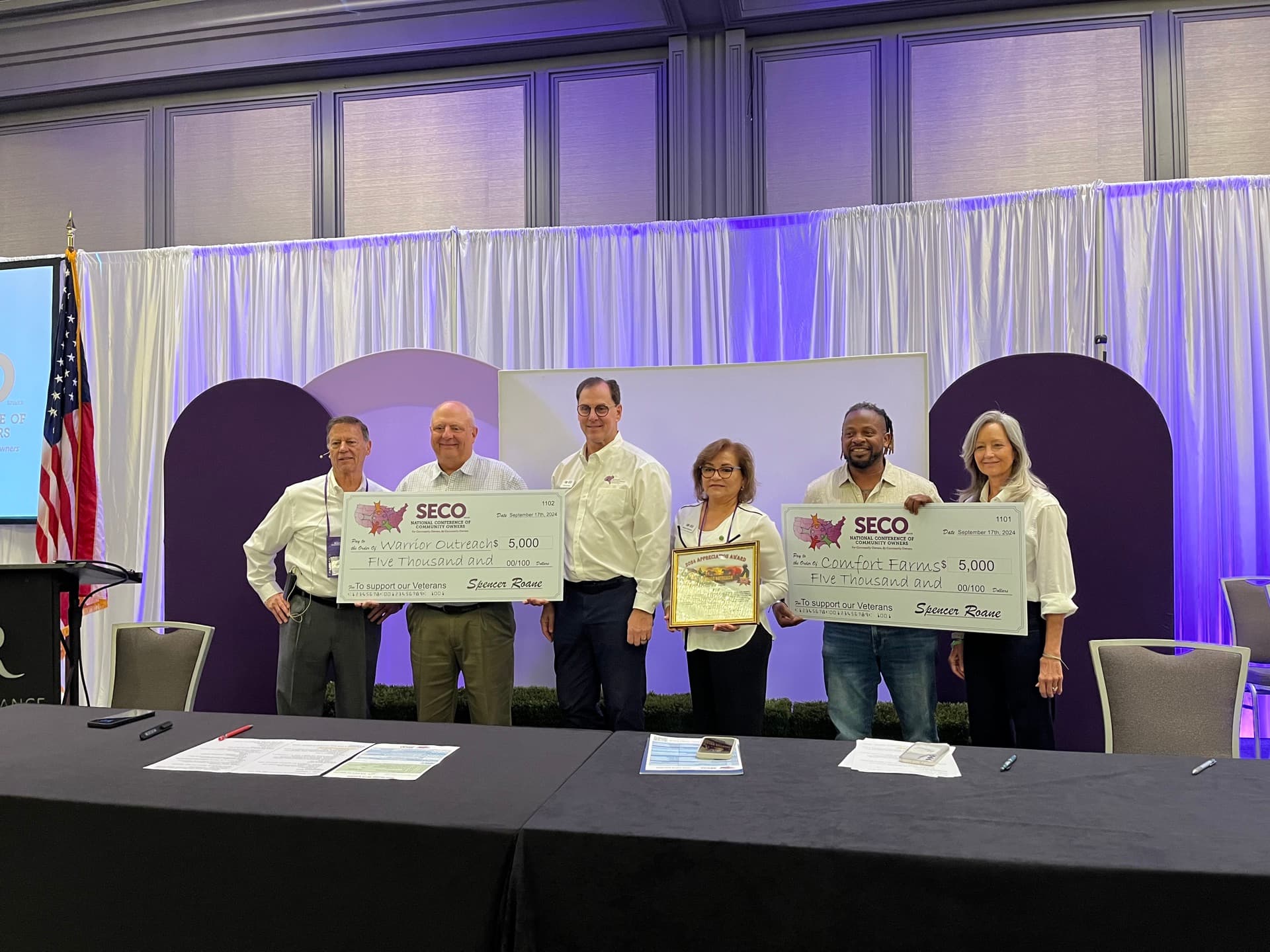 SECO leadership presenting charity donations to veterans and first responder organizations